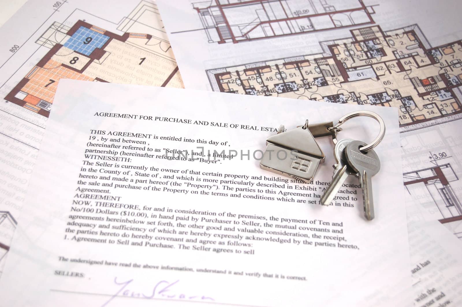 Keys on mortgage note and blueprints