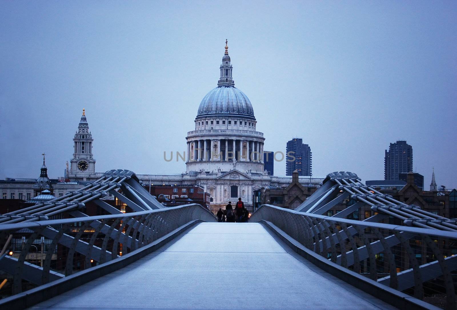 St Paul's Cathedral and Millenium Bridge in London at evening. 