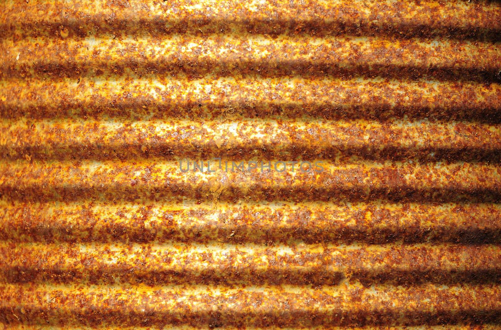 Closeup of rusty corrugated metal can surface 