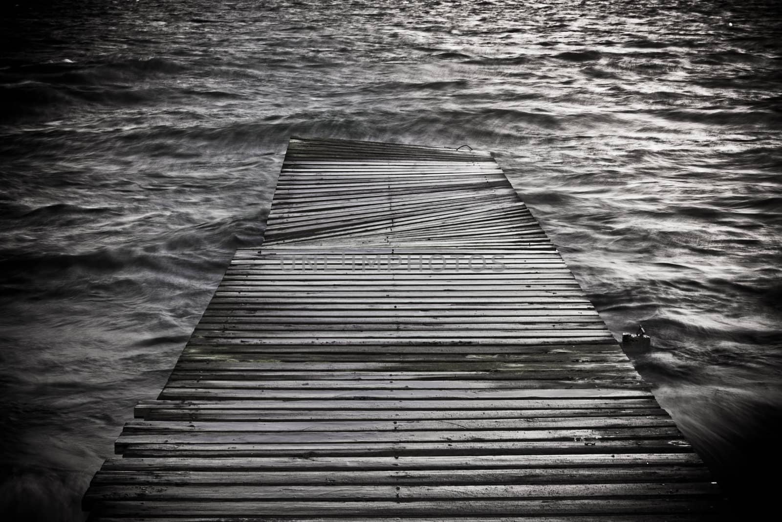 black and white creative photo of a footbridge
