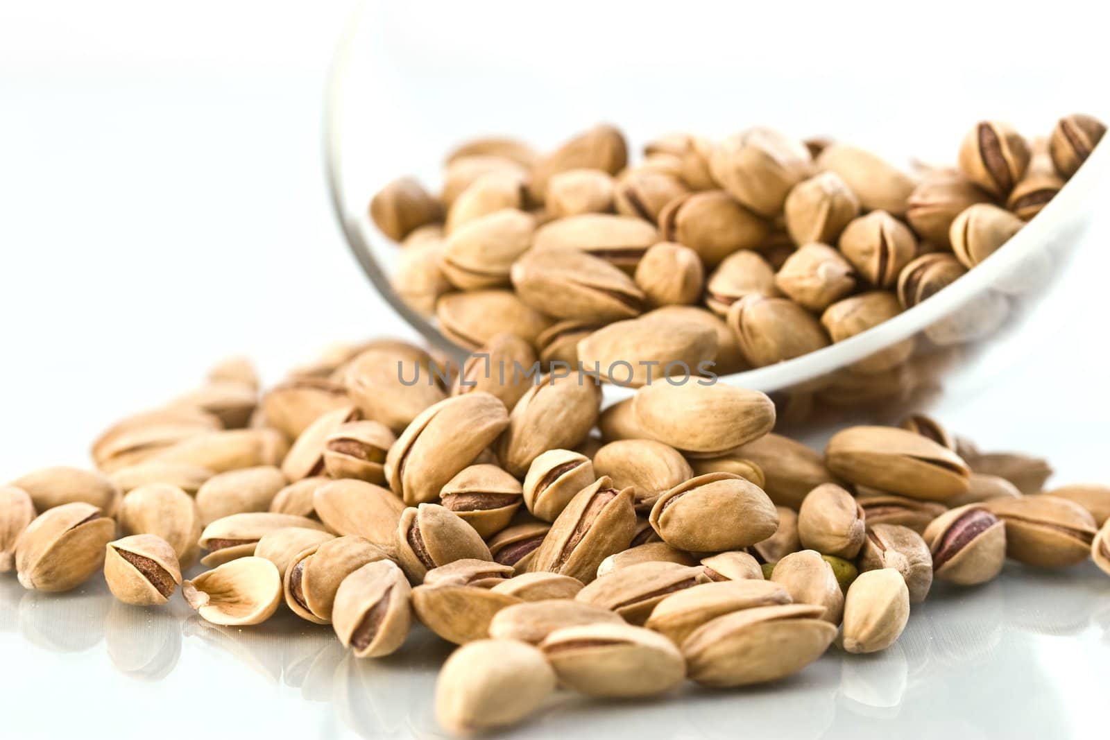 food serias: macro picture of scattered pistachio nuts