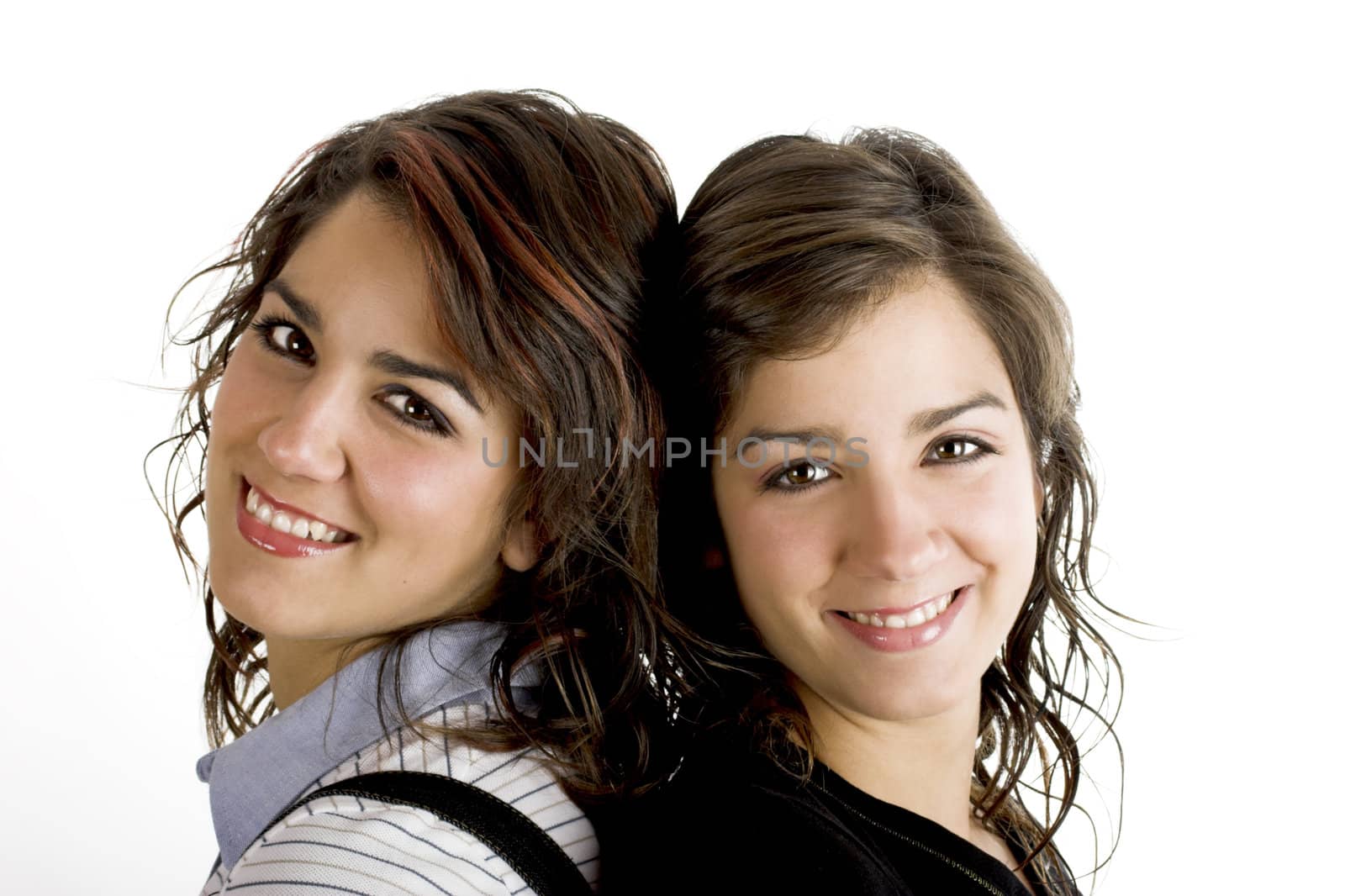 Portrait of two young and beautiful sisters - This models are twins
