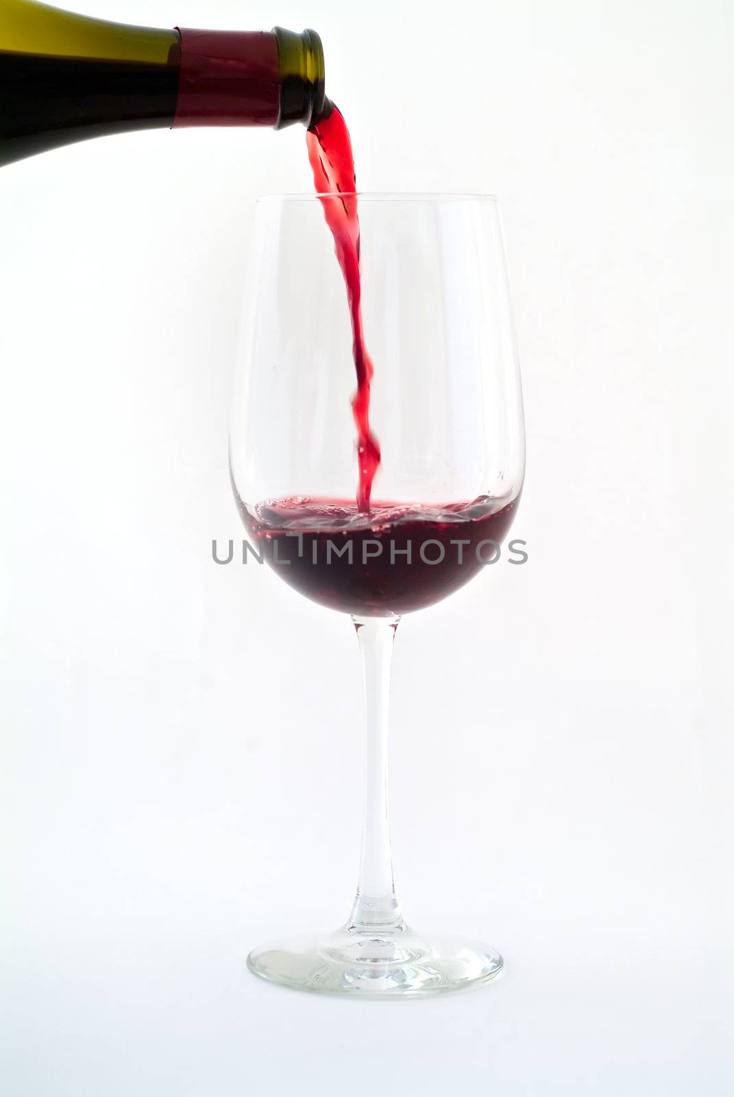 pouring red wine by noam