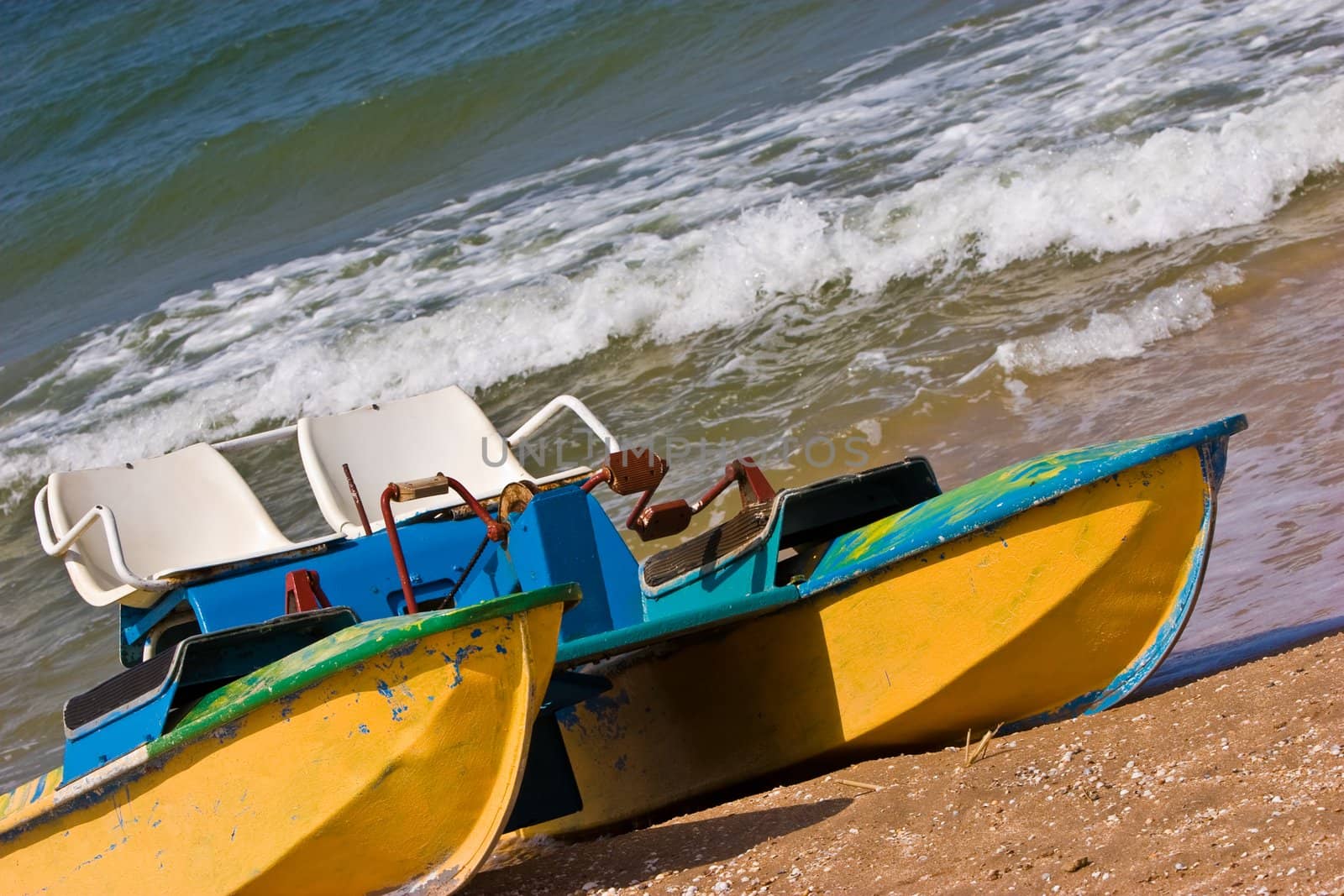 leisure series: promenade catamaran on the beach of stormy sea
