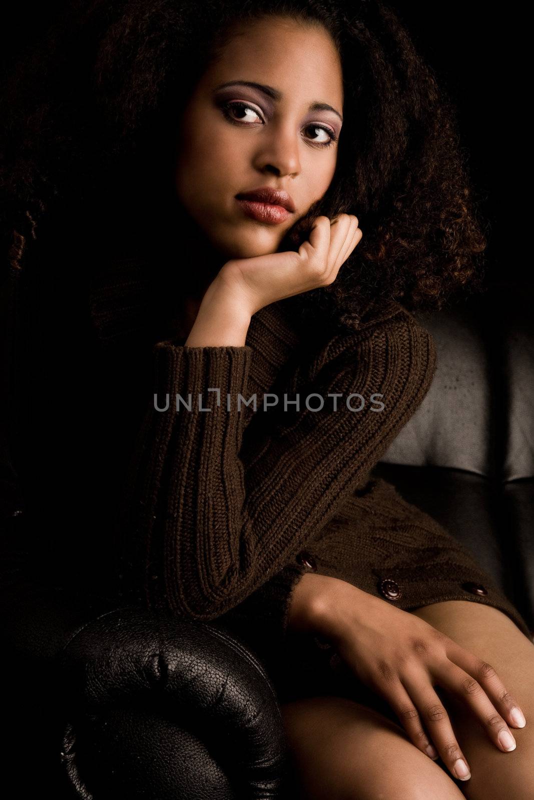 Portrait of a african girl is waiting on the coach
