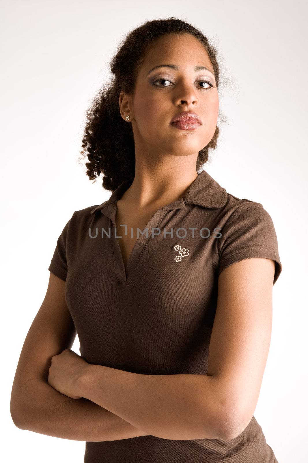 African woman is waiting with her arms crossed