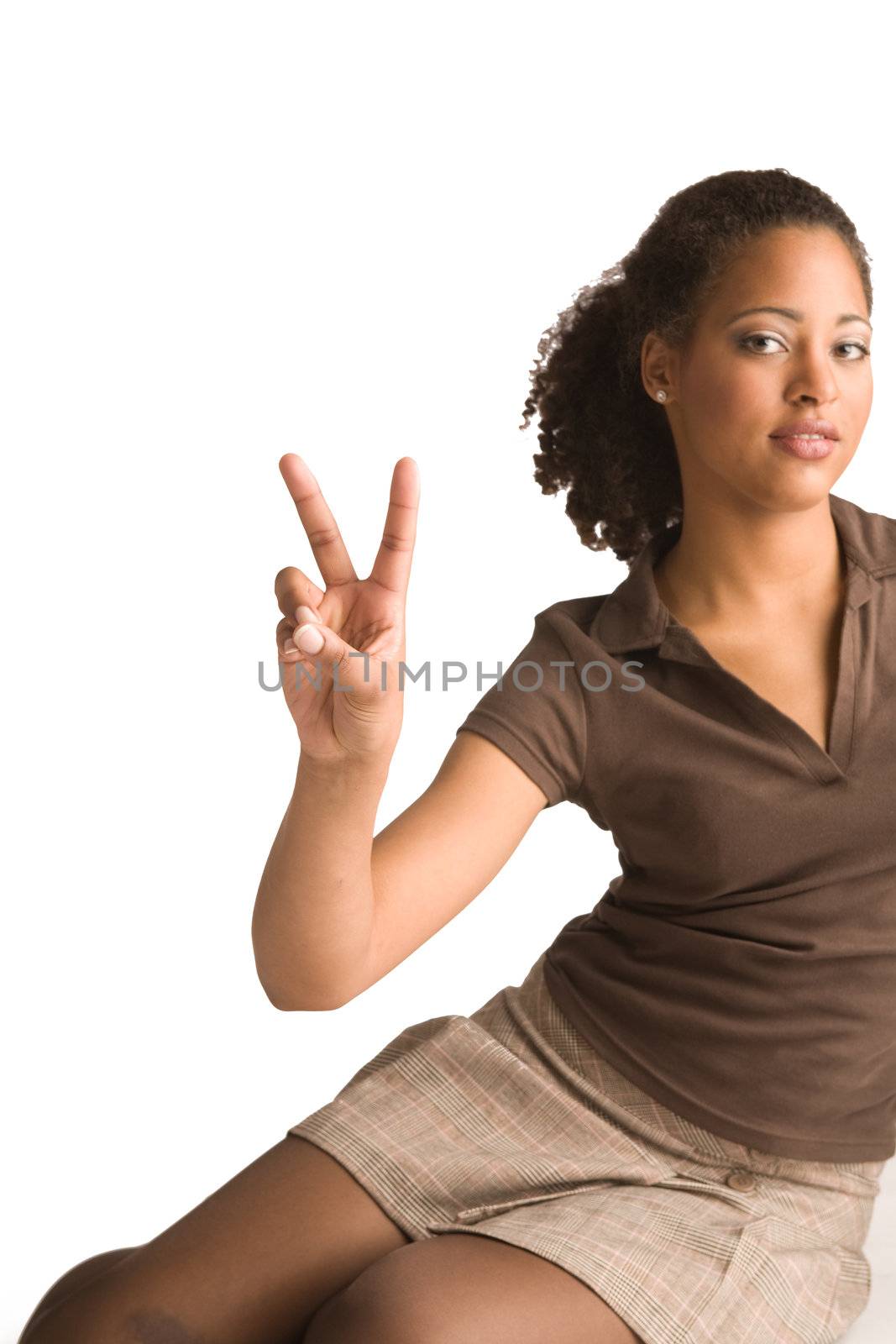 Beautiful african young woman gives a peace sign