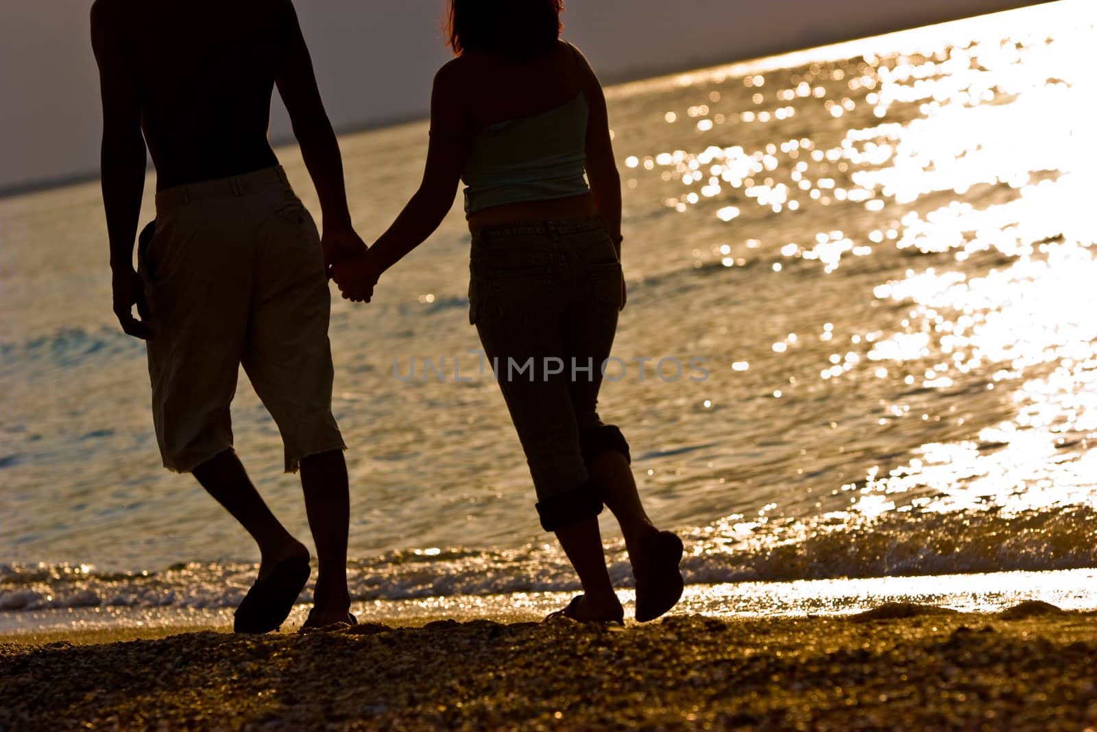 leisure series: two lovers silhouette on the beach