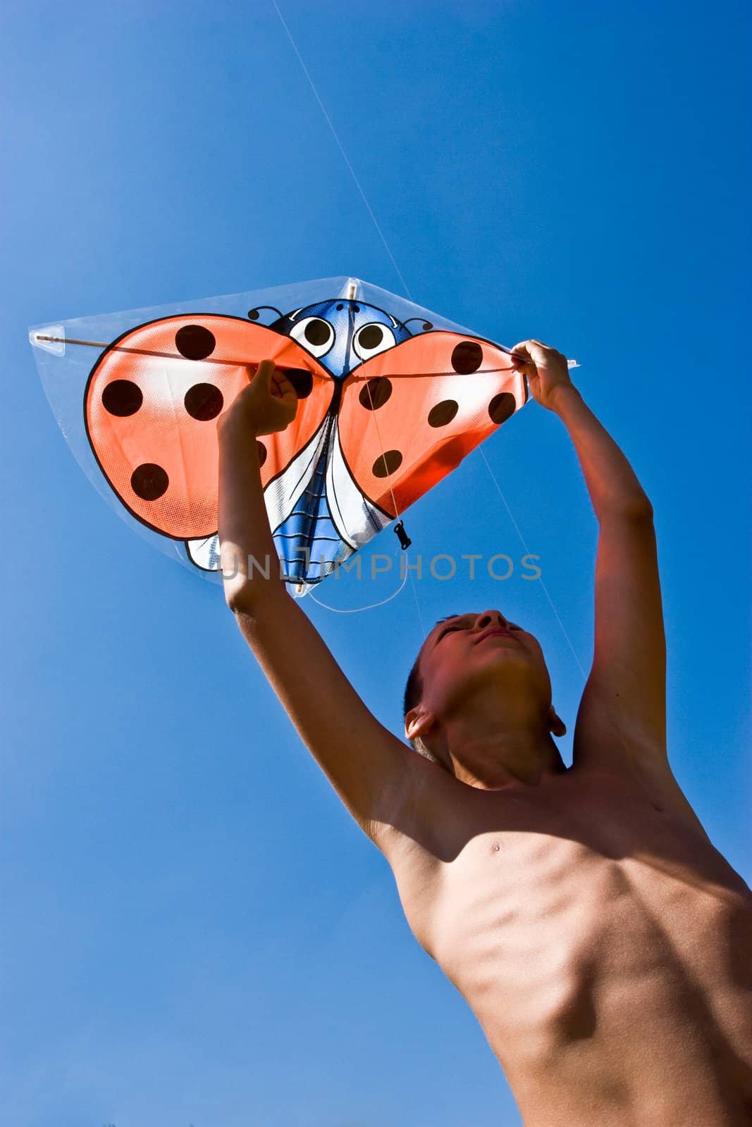 vacation, portrait of summer boy with kite