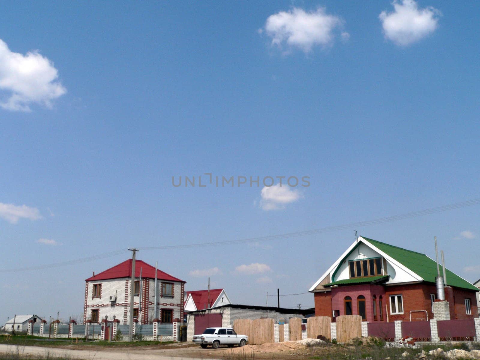 Two houses in rural terrain