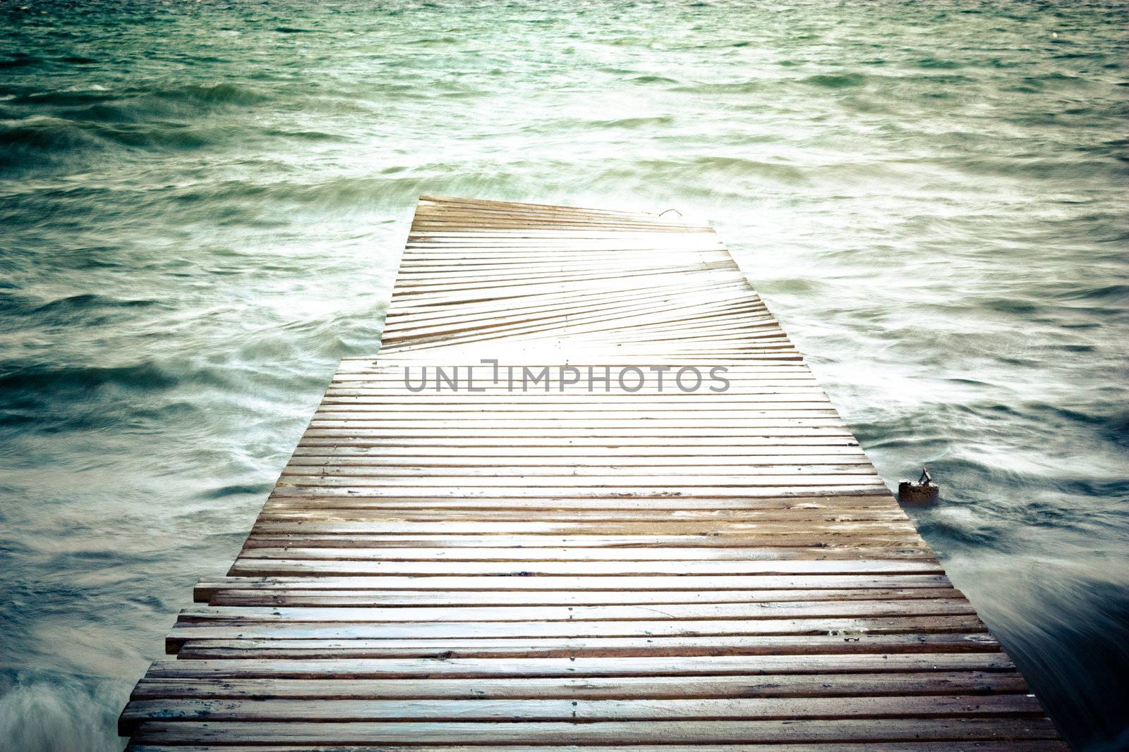 creative old footbridge on the water
