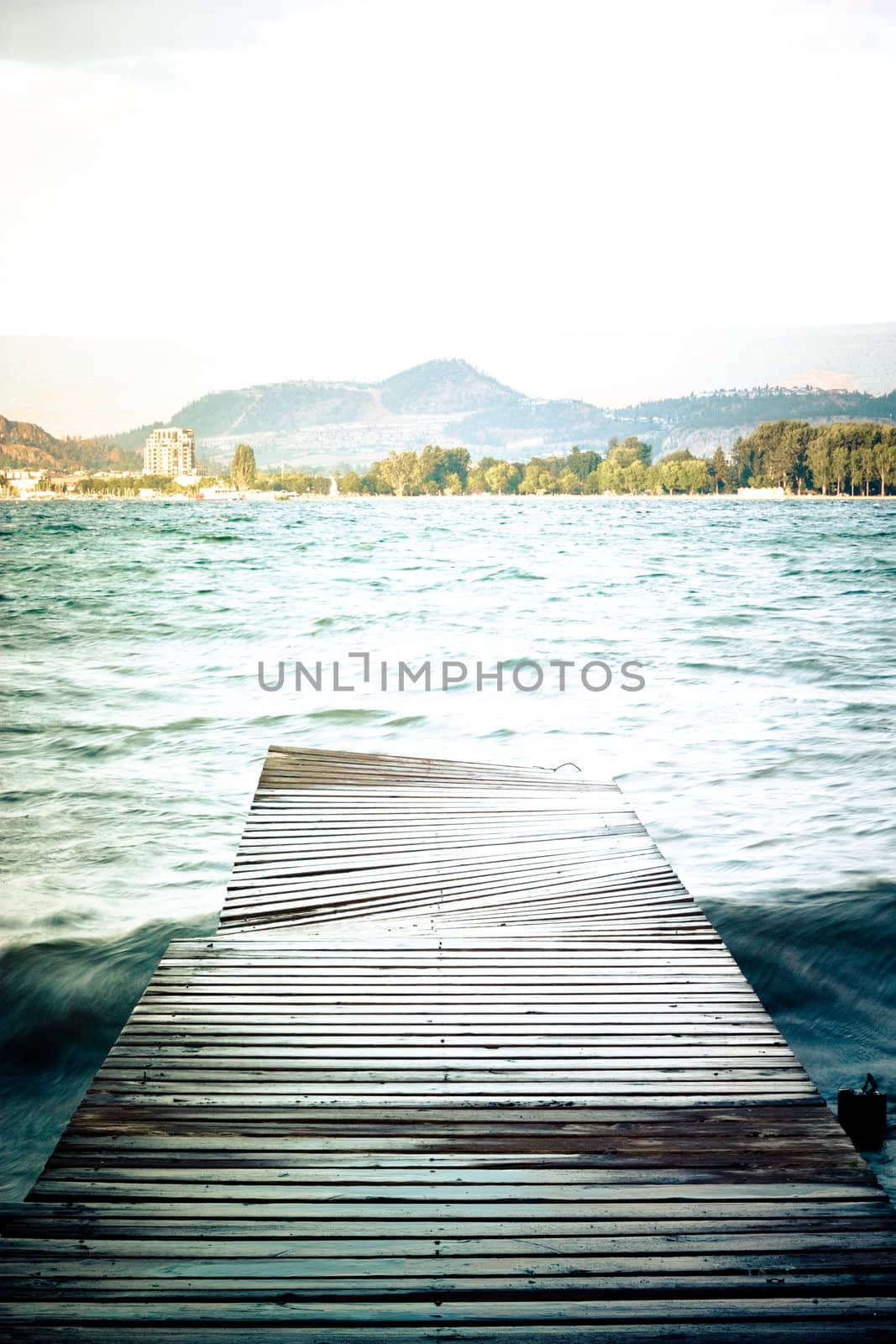 vertical footbridge, lake and mountains view
