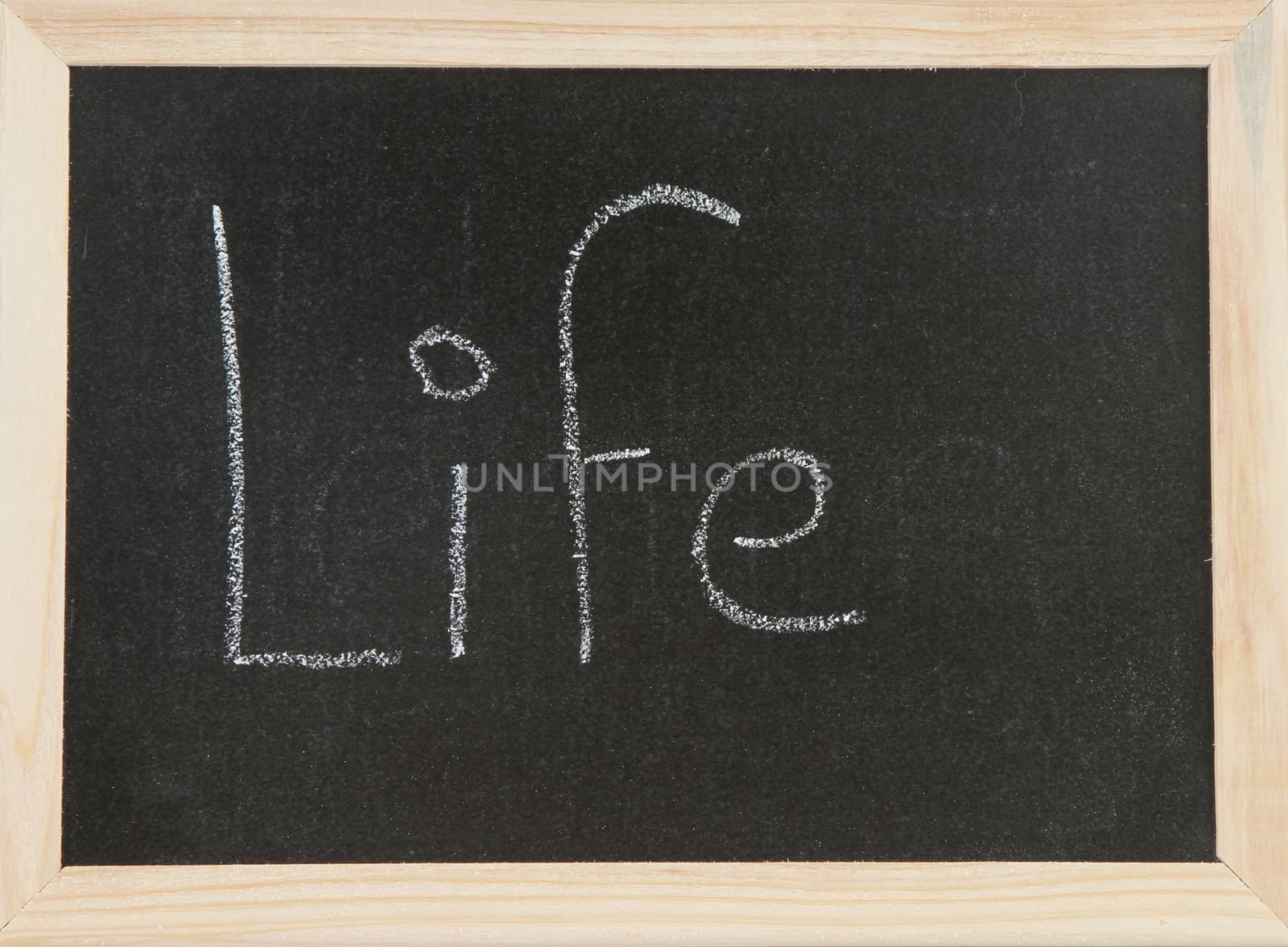 Black chalk board with wooden framed surround with the word Life.