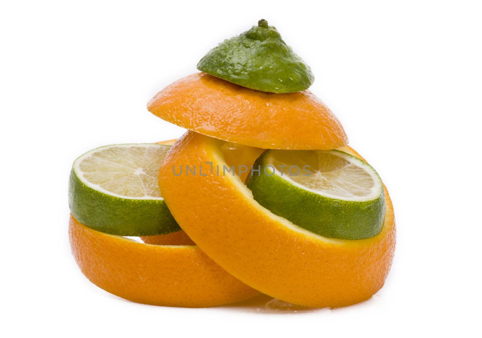 Lime slices in orange peels on white background - isolated