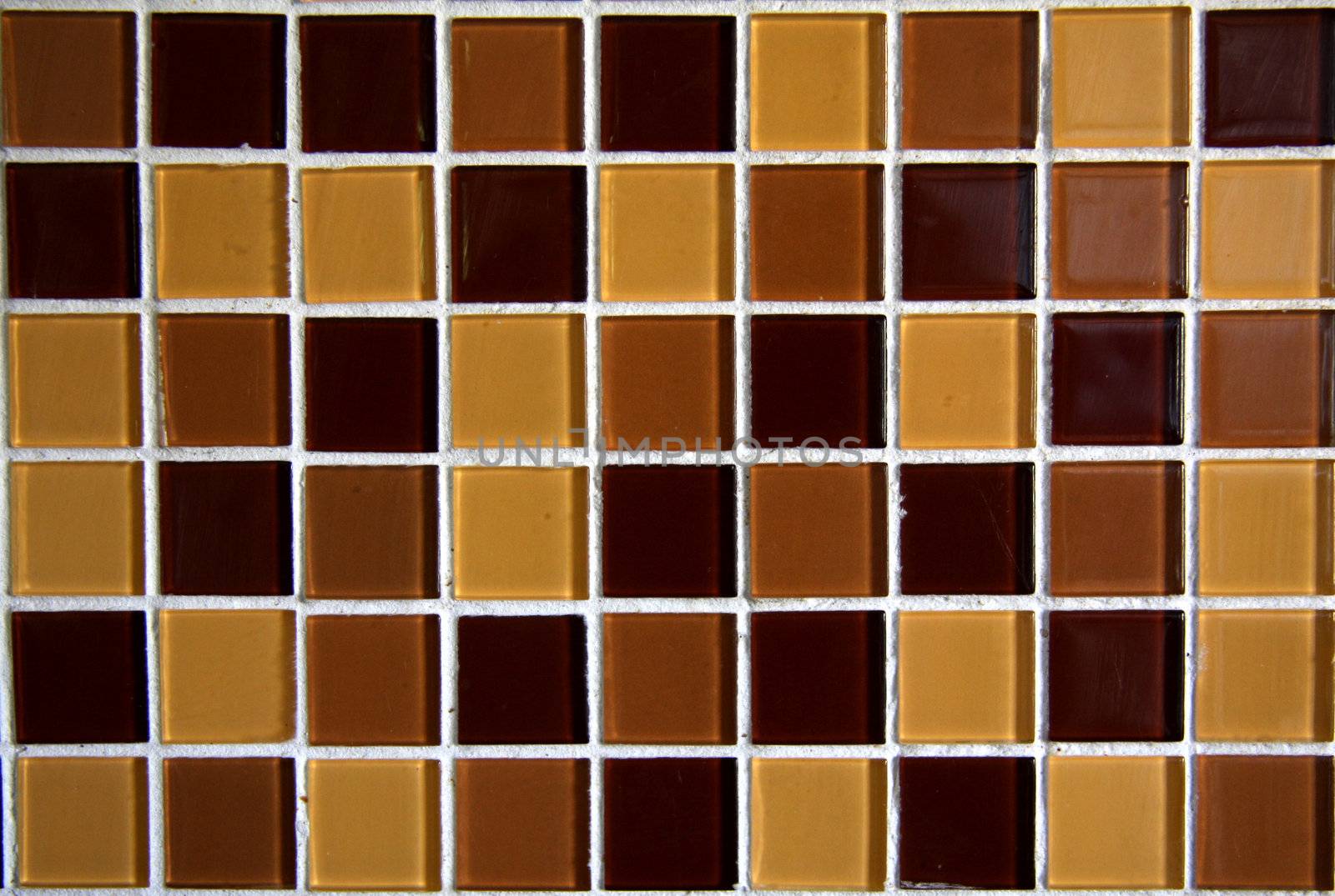 Glass mosaic with different brown colors.