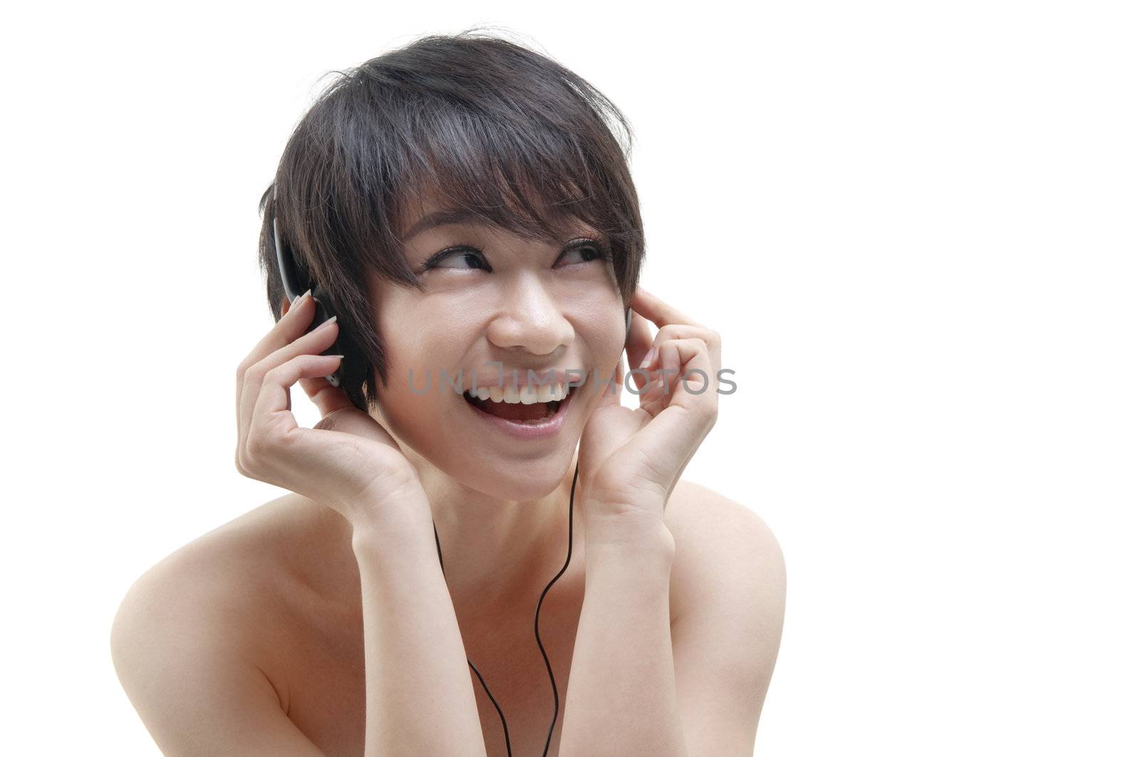 Young woman relaxing, listening to music, on white background.