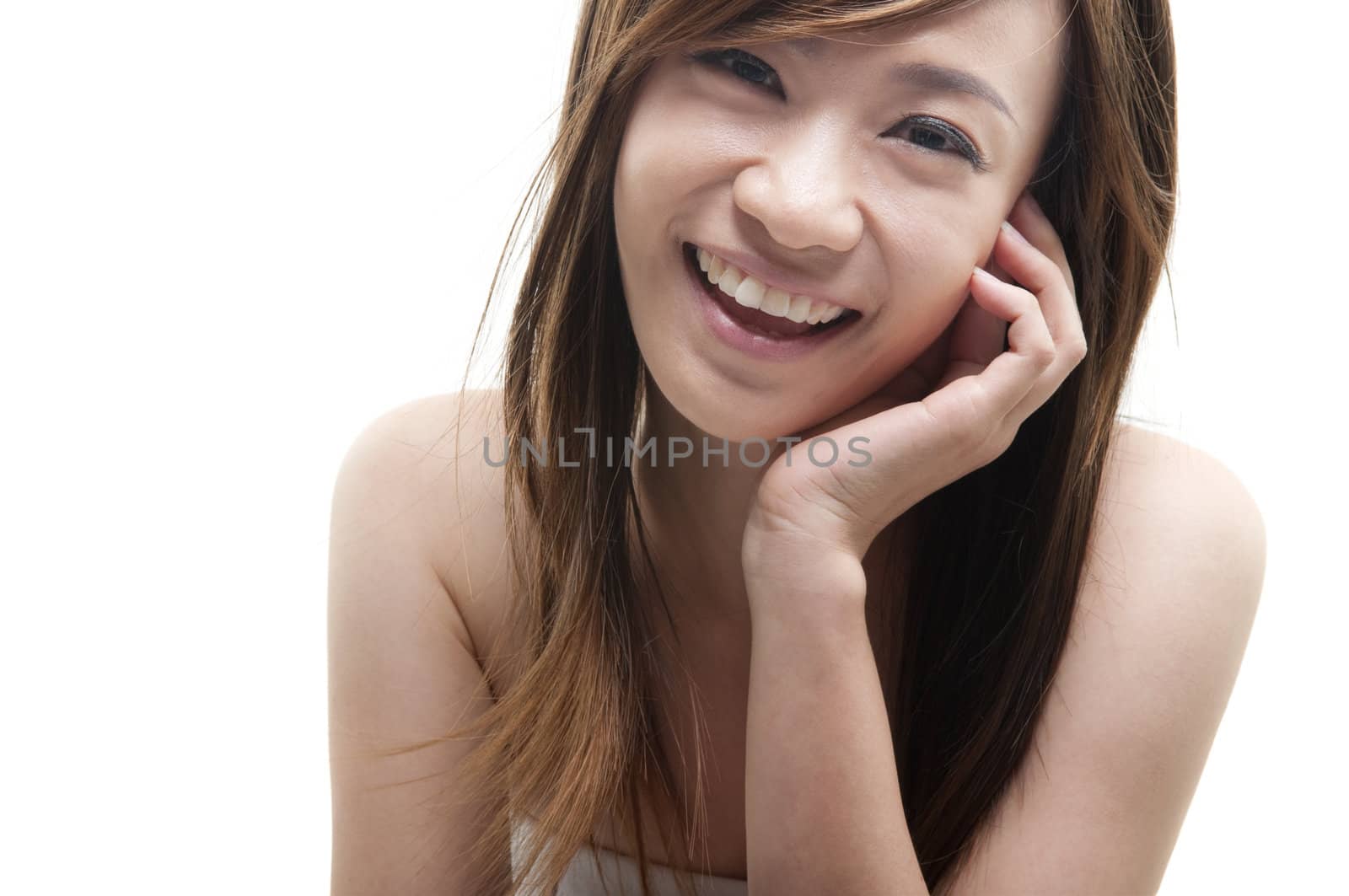 Cute Asian female smiling on white background
