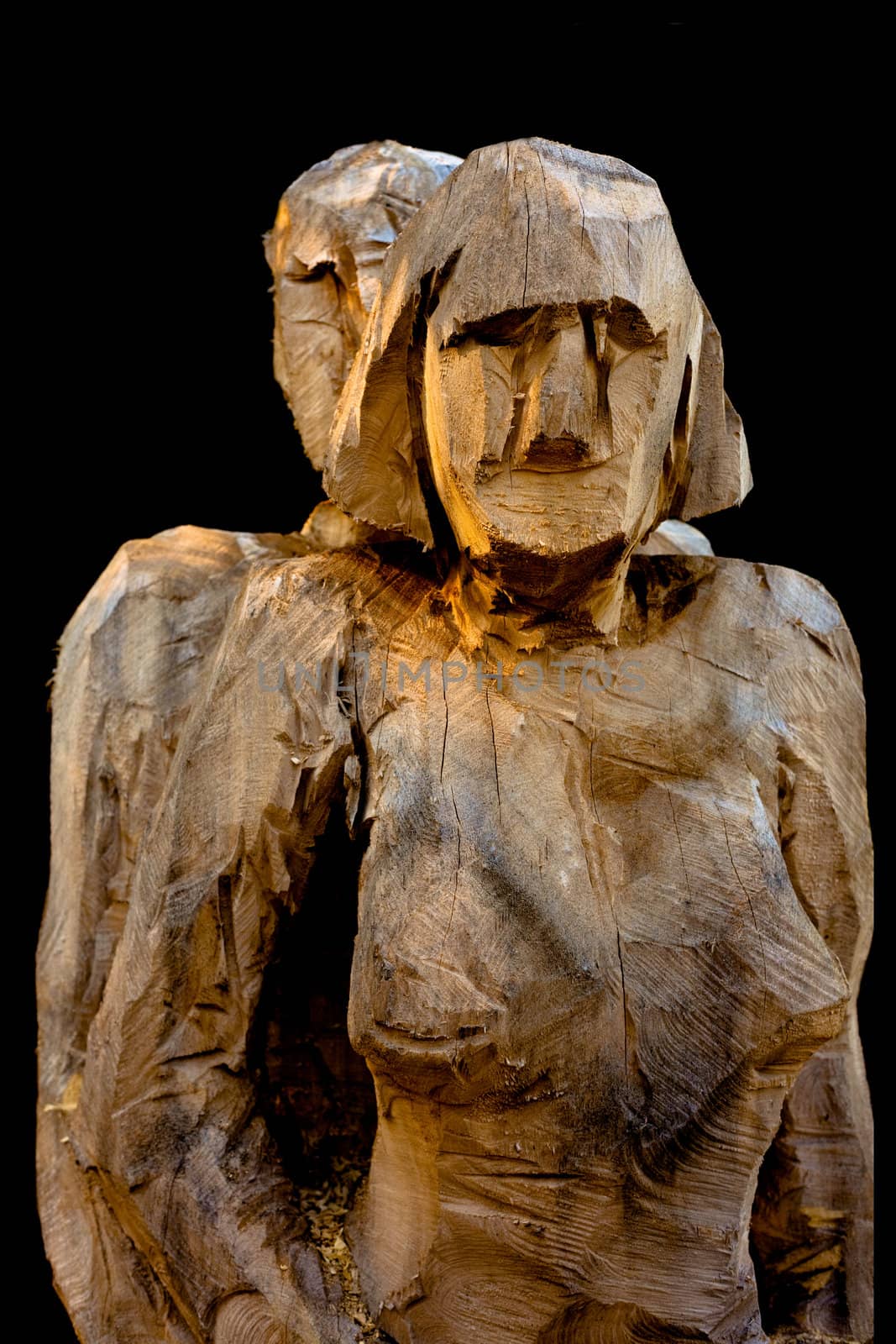 Wooden female and male sculpture rough cut chainsaw art