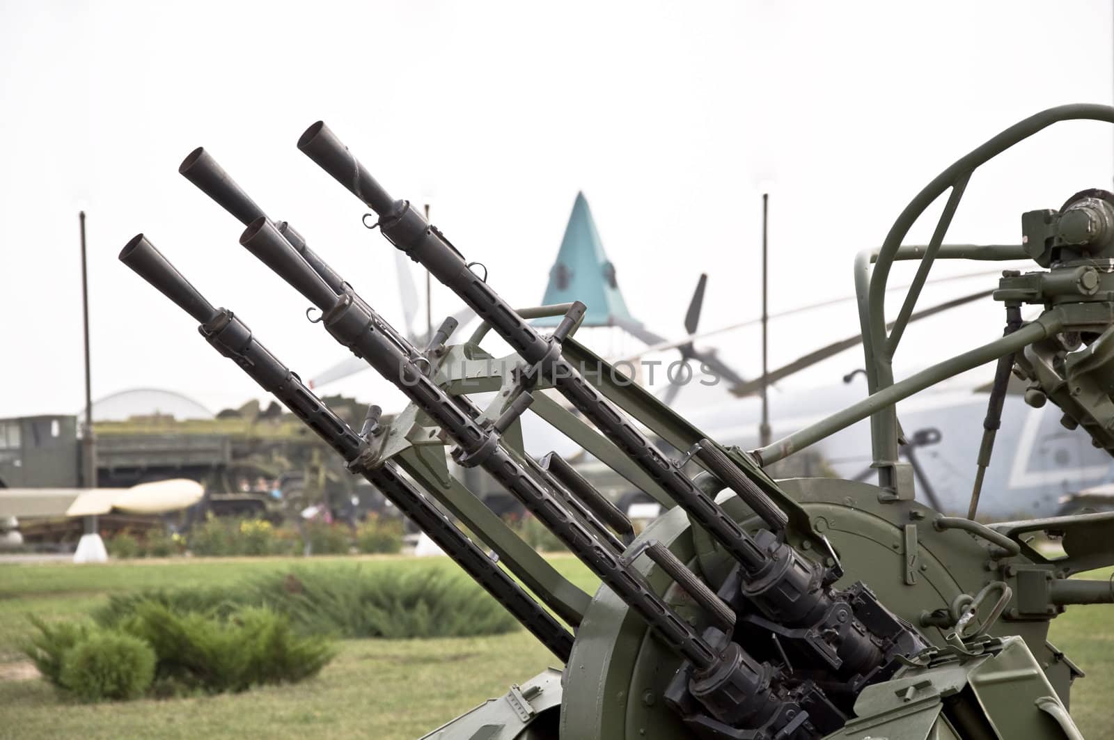 Trunks of anti-aircraft machine guns aimed at the sky. Small defensive weaponry.