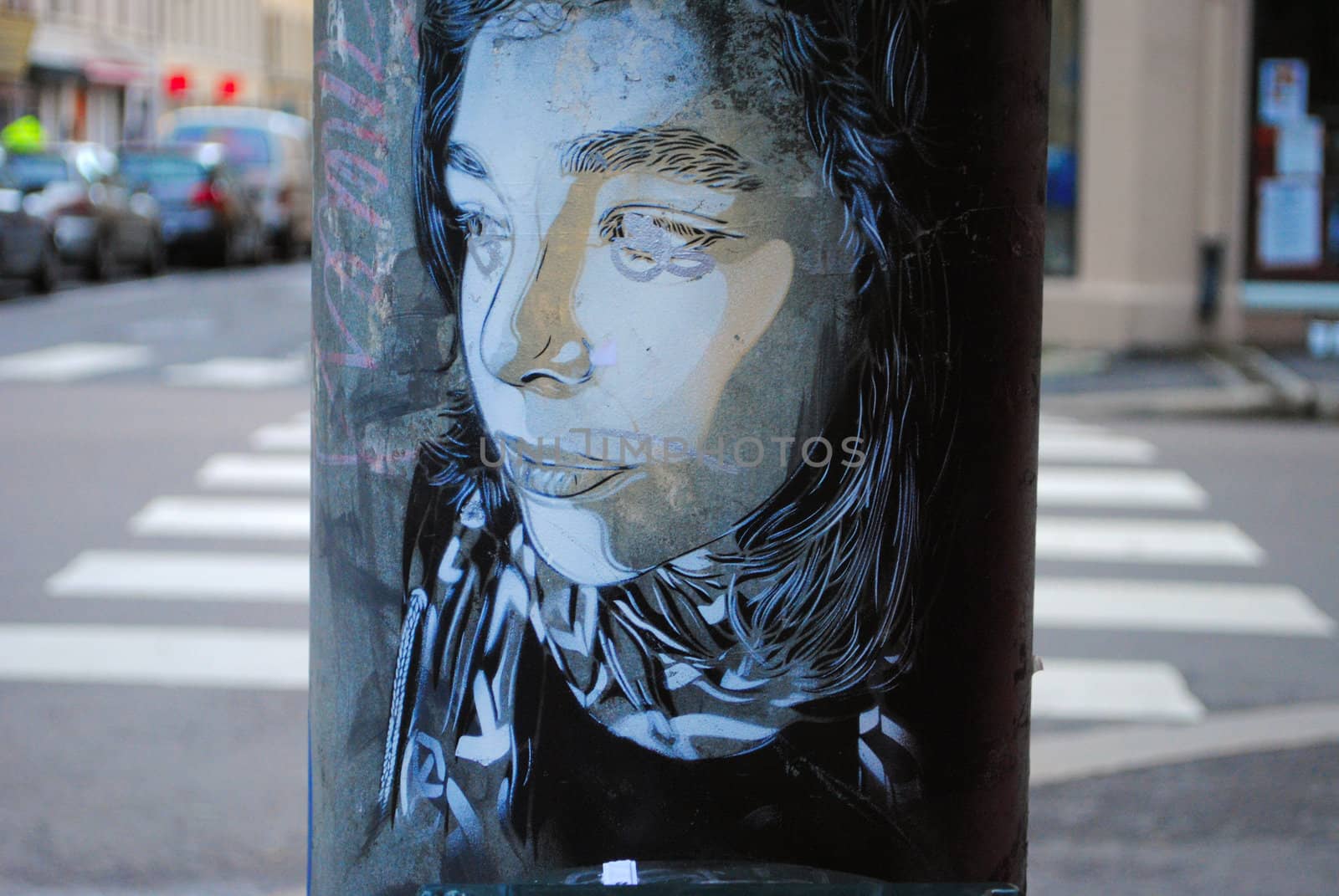 Street art portrait depicting a young woman.