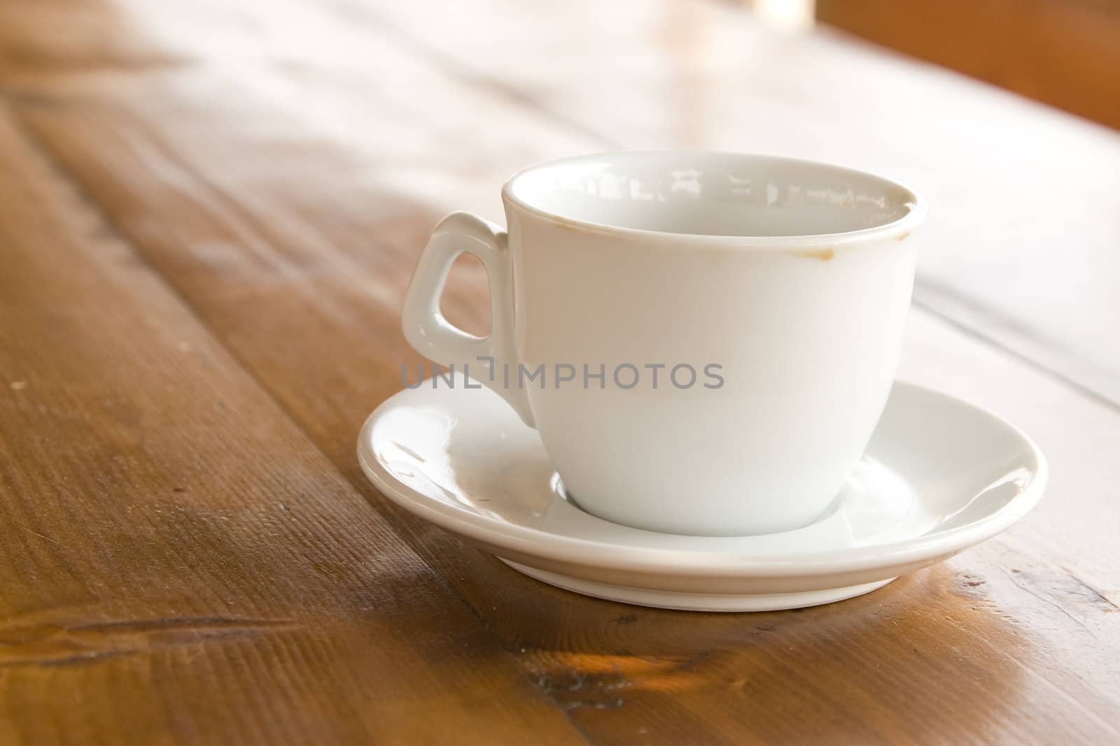 front view of coffee cup on wooden table