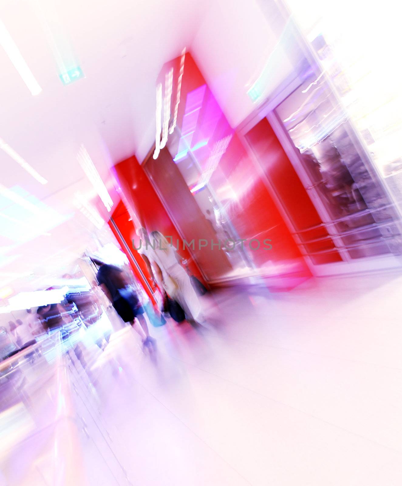 blurred unrecognizable people in motion in a shopping mall