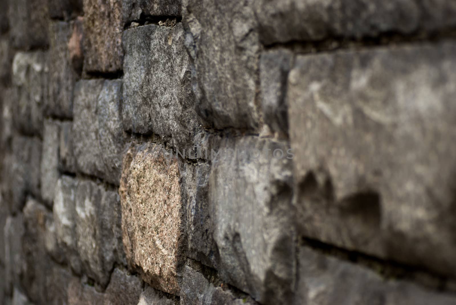 a stone wall with an irregular pattern