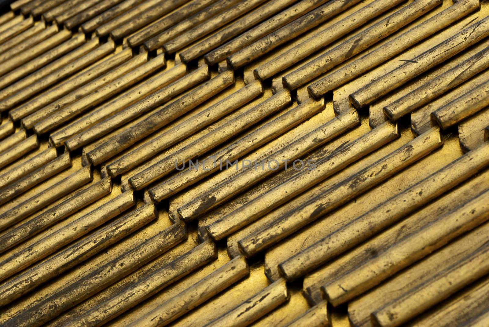 detail of roofing tiles painted gold