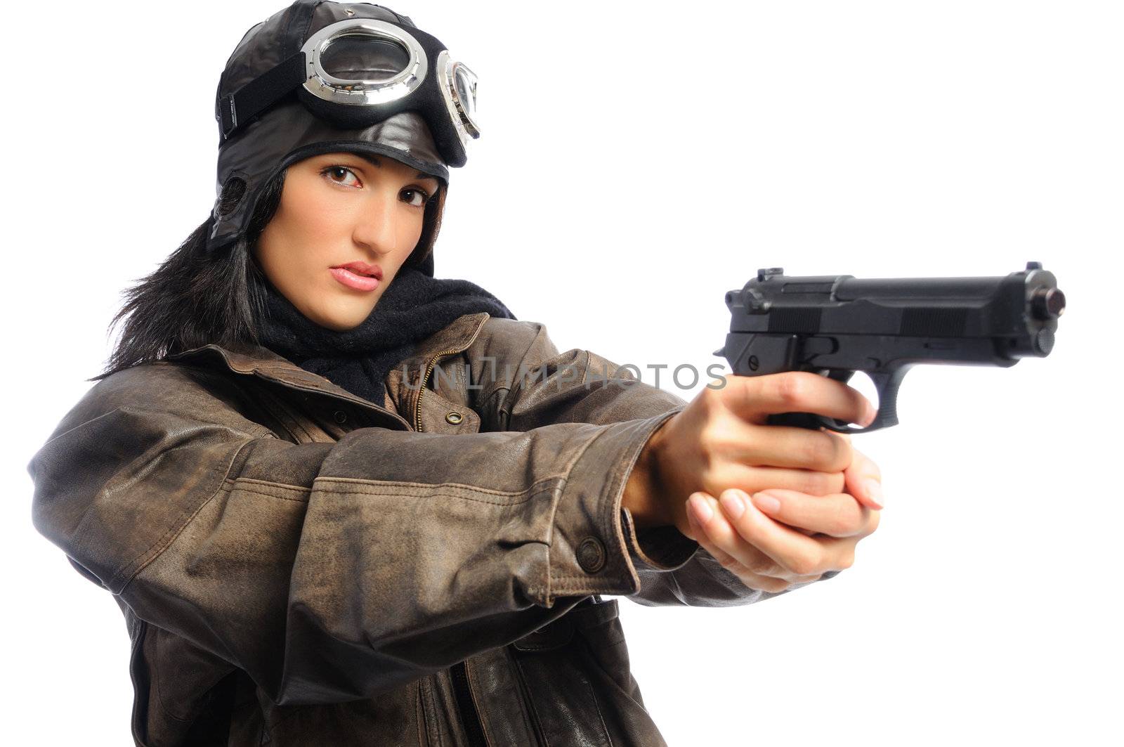 Hispanic woman in a vintage aviator costume holding a gun on a white background