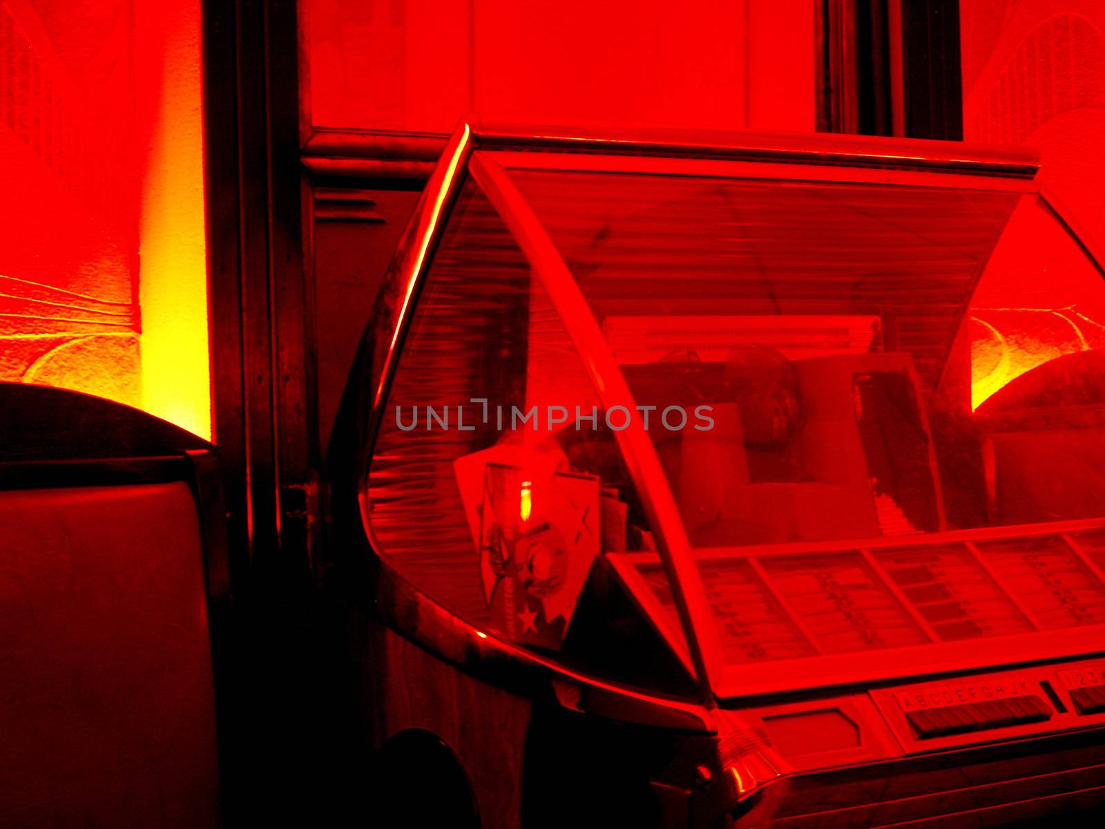 Juke box in a red lit room.  (Ambiant not created)