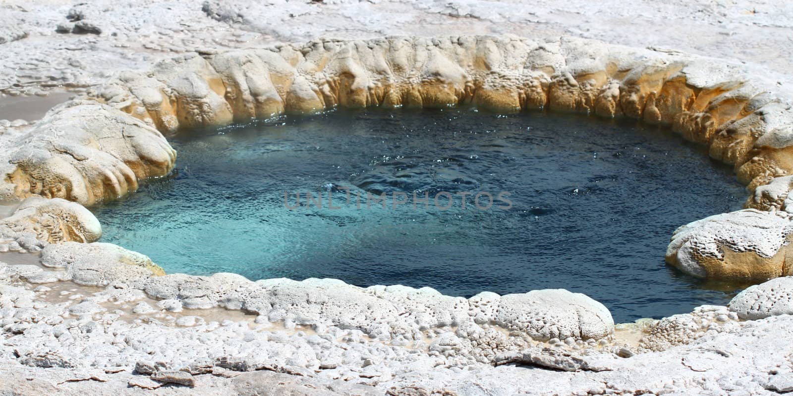 Hot water churns in Beach Spring at the Upper Geyser Basin of Yellowstone National Park.