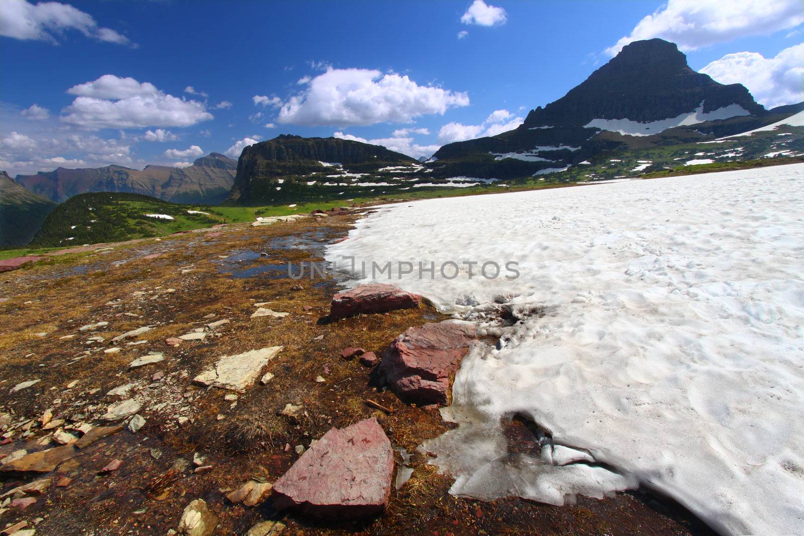 Snow remains even in late August at Logan Pass of Glacier National Park - USA.