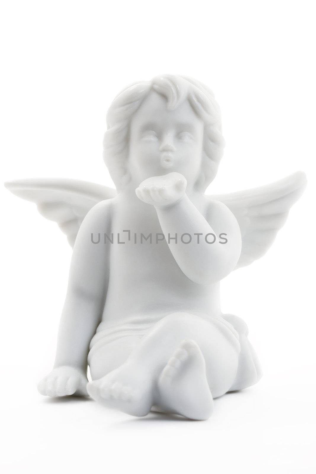 kissing white christmas angel figurine on white background