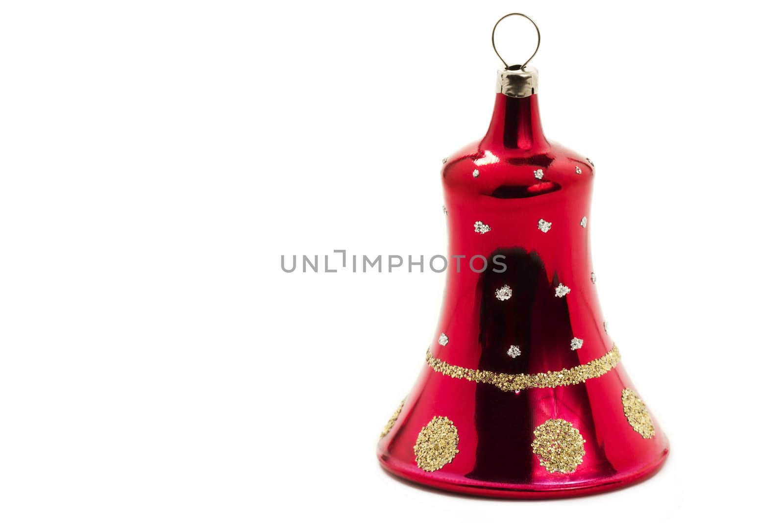 red christmas ornament in bell shape on white background