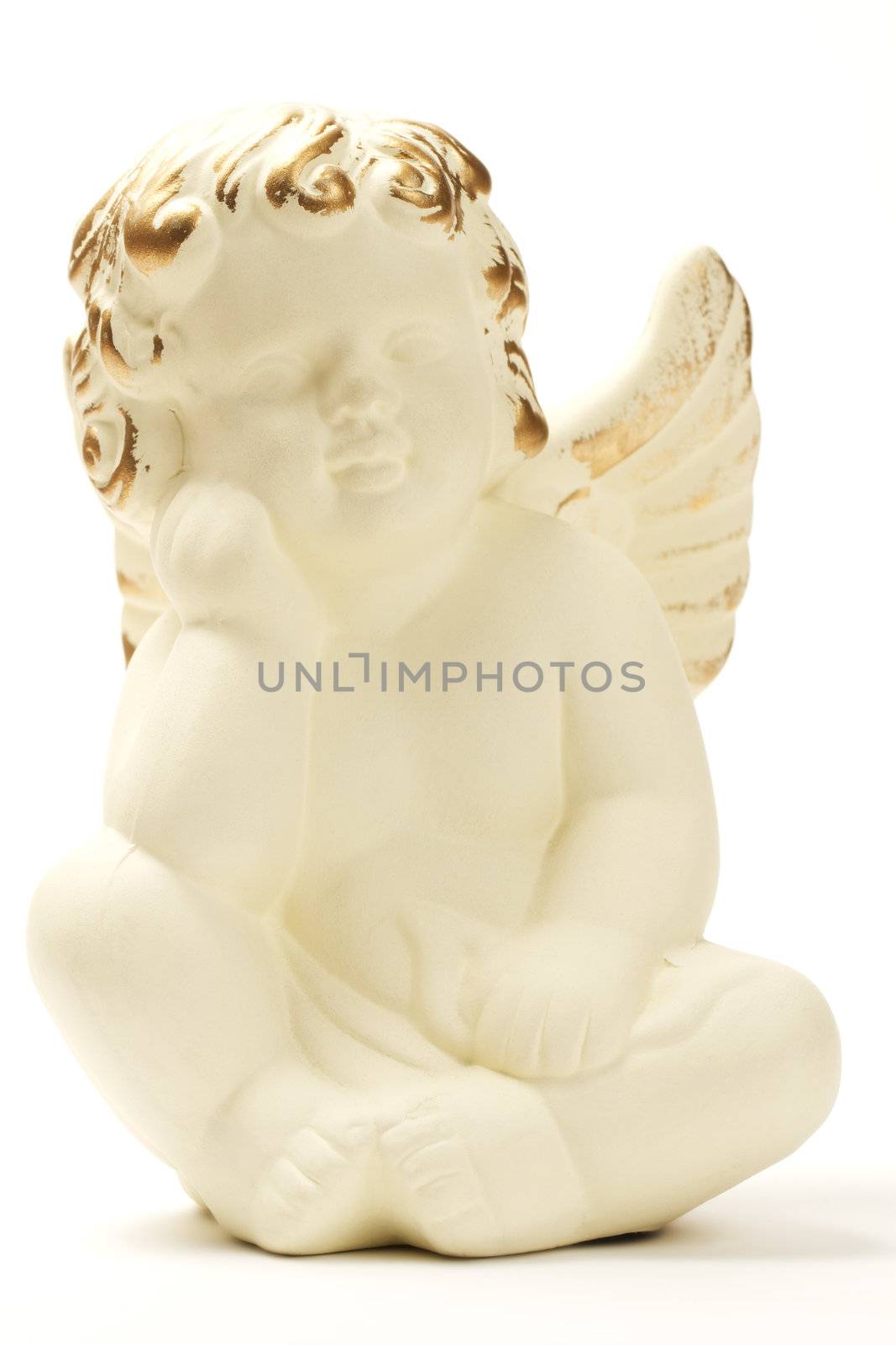 yellowish christmas angel figurine on white background