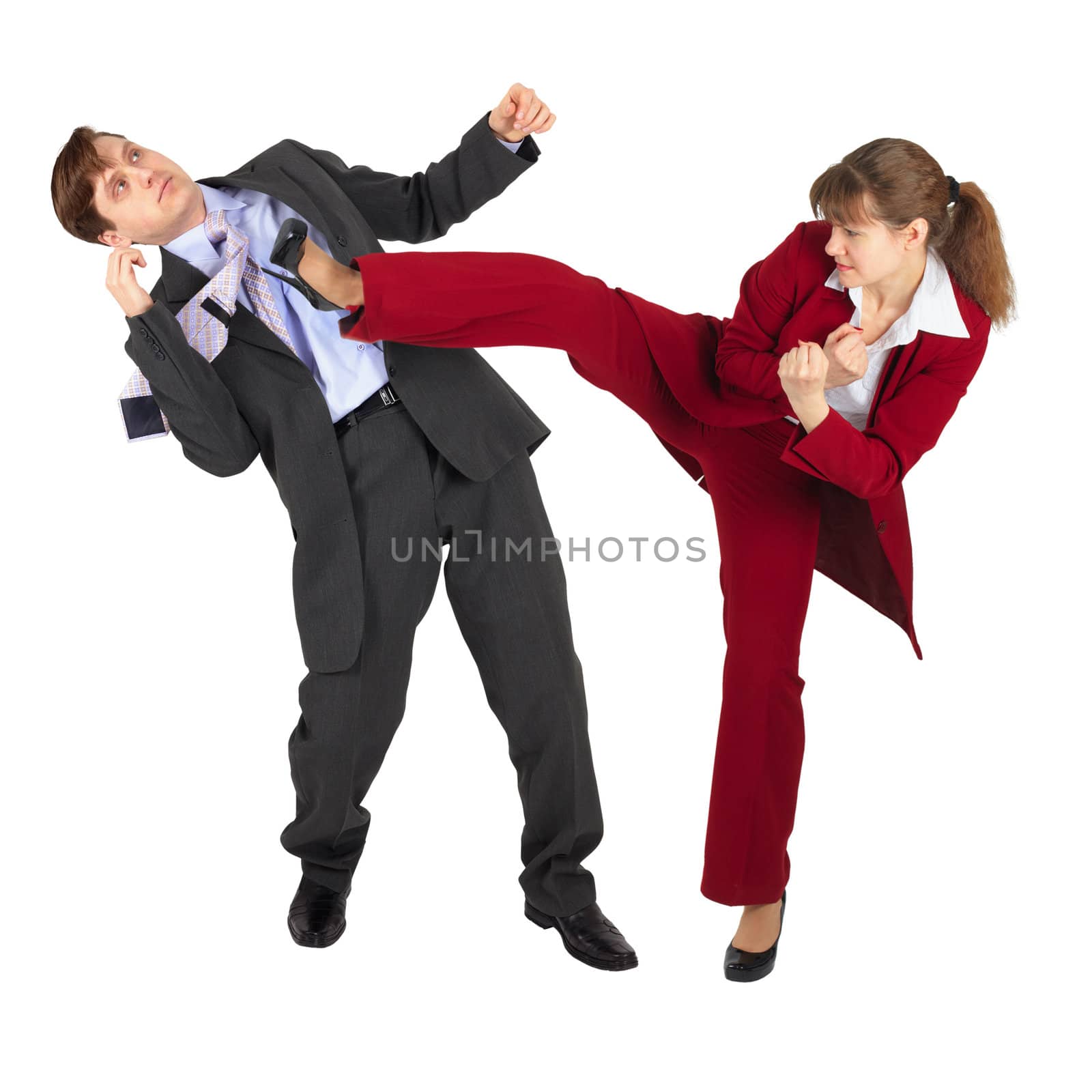 The young woman kicks the man in a business suit