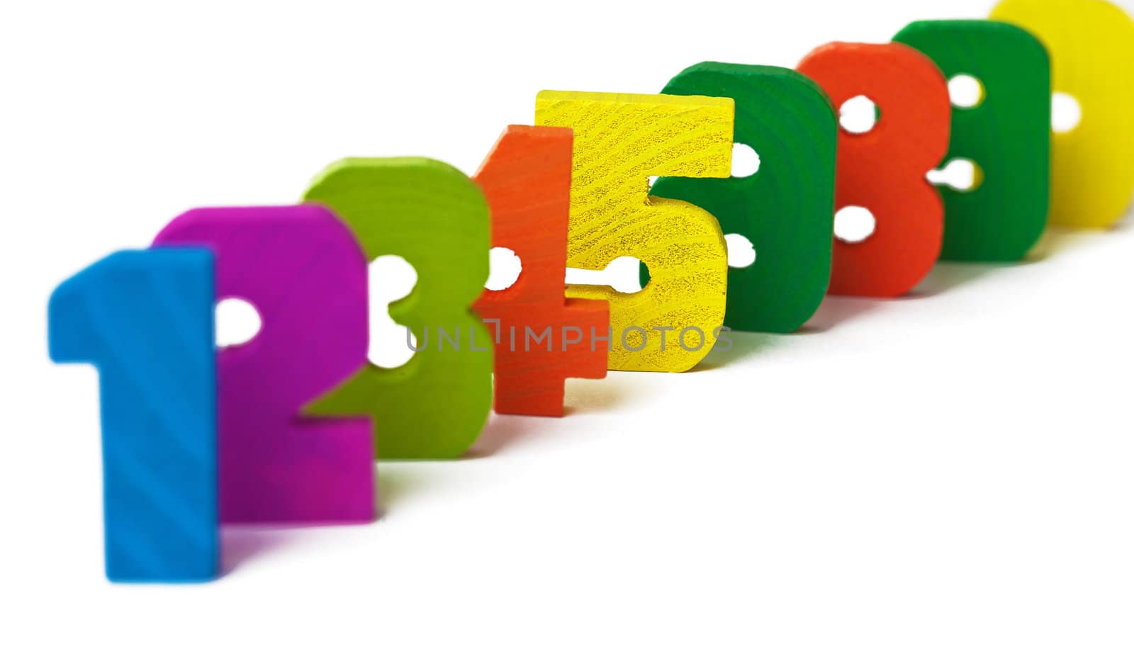Line from wooden figures one after another on a white background