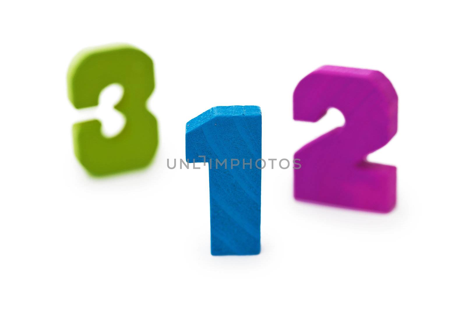 Three wooden toy figures on a white background
