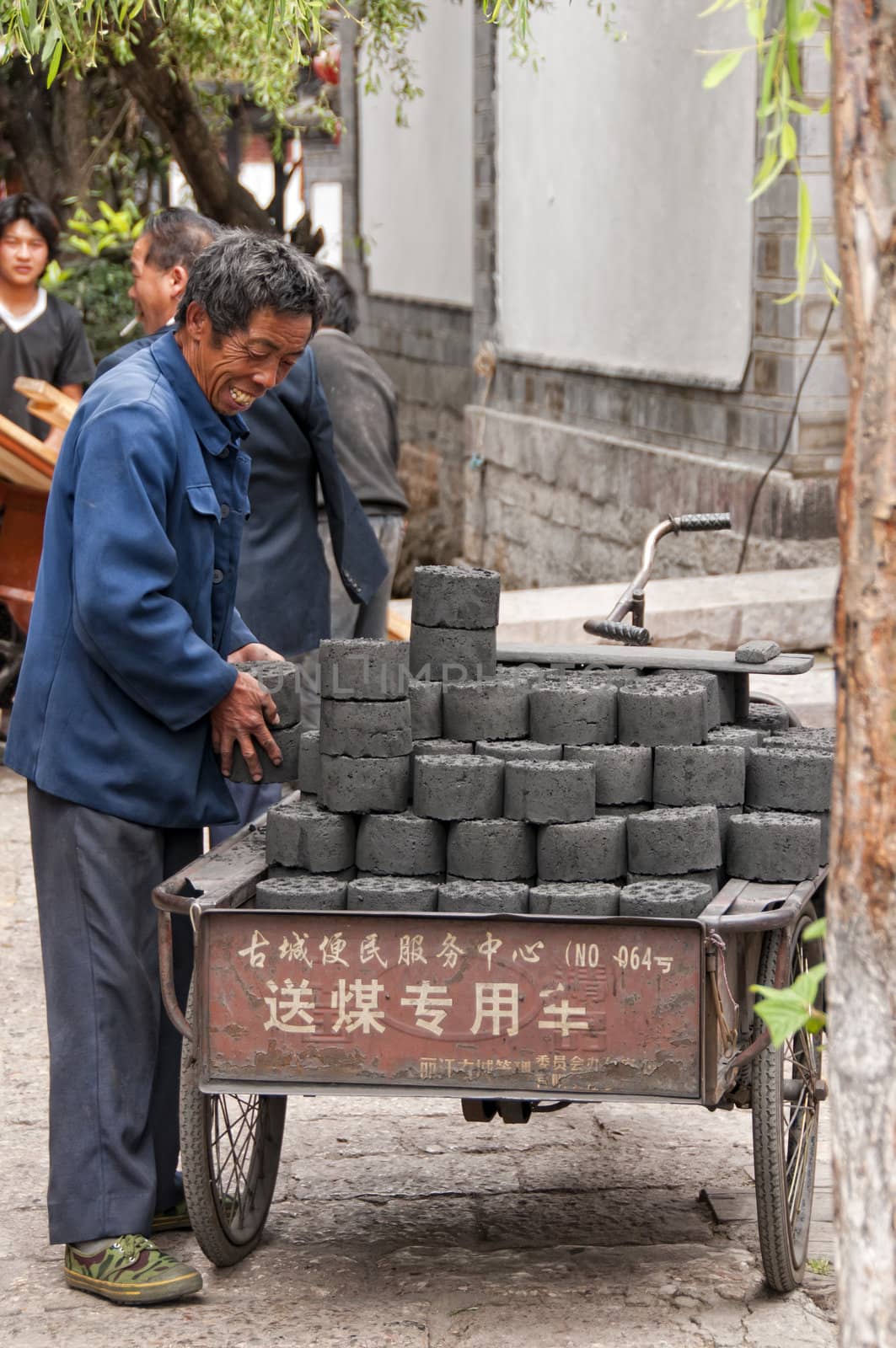 Unidentified Man delivering Coal in Lijiang, China, July 8 2010. The People's Republic of China is the largest consumer of coal in the world.