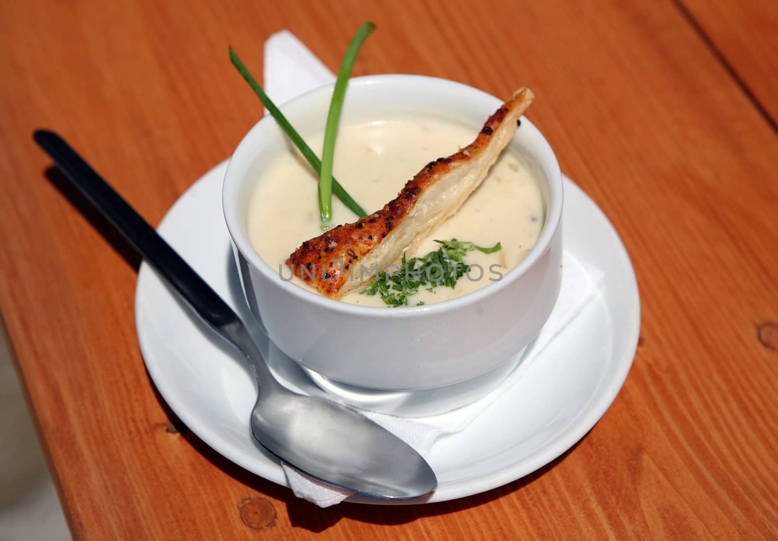 Traditional home made soup called Kyselica in bowl on wooden table from Walachia