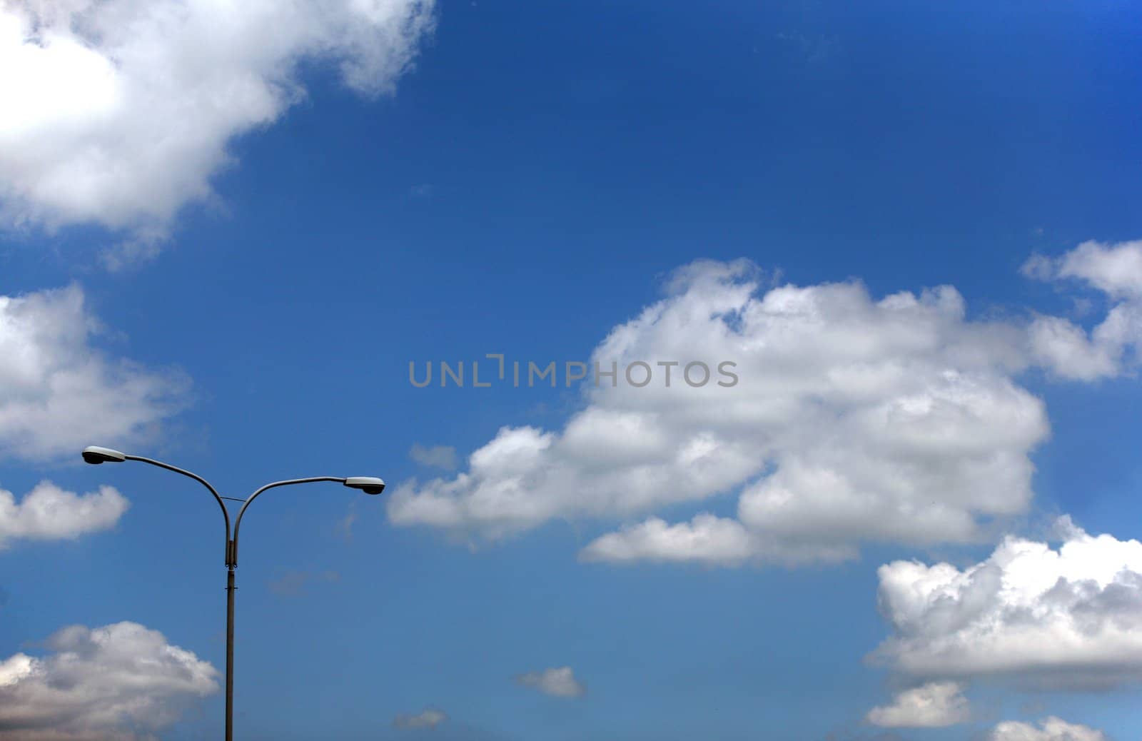 Street lamp on cloudy sky background