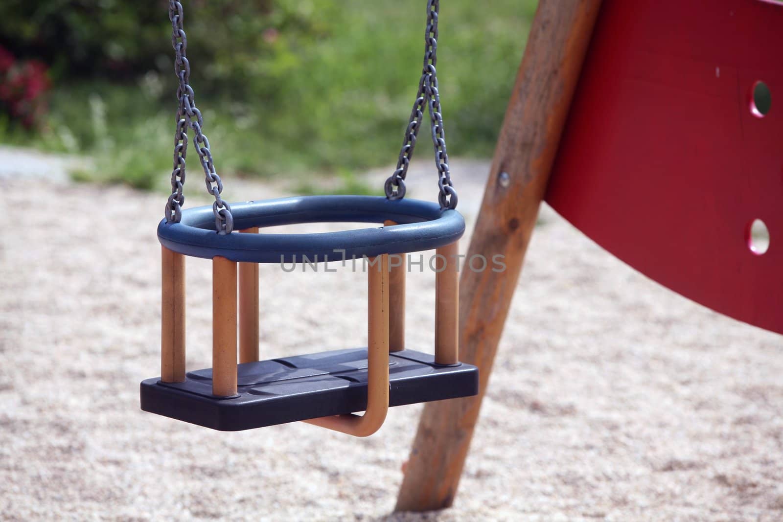 Detail of empty swing on playground