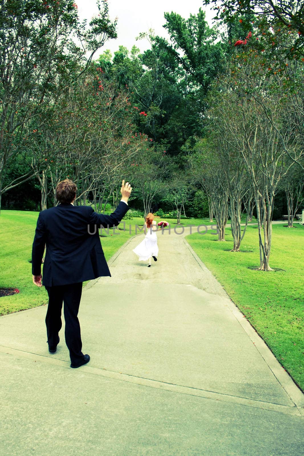 Cross processed photo of a bride running away from her groom