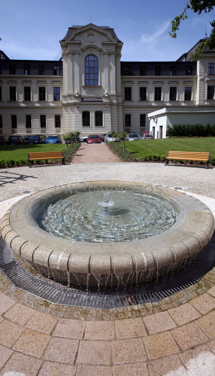 Garden of historical building with small fountain