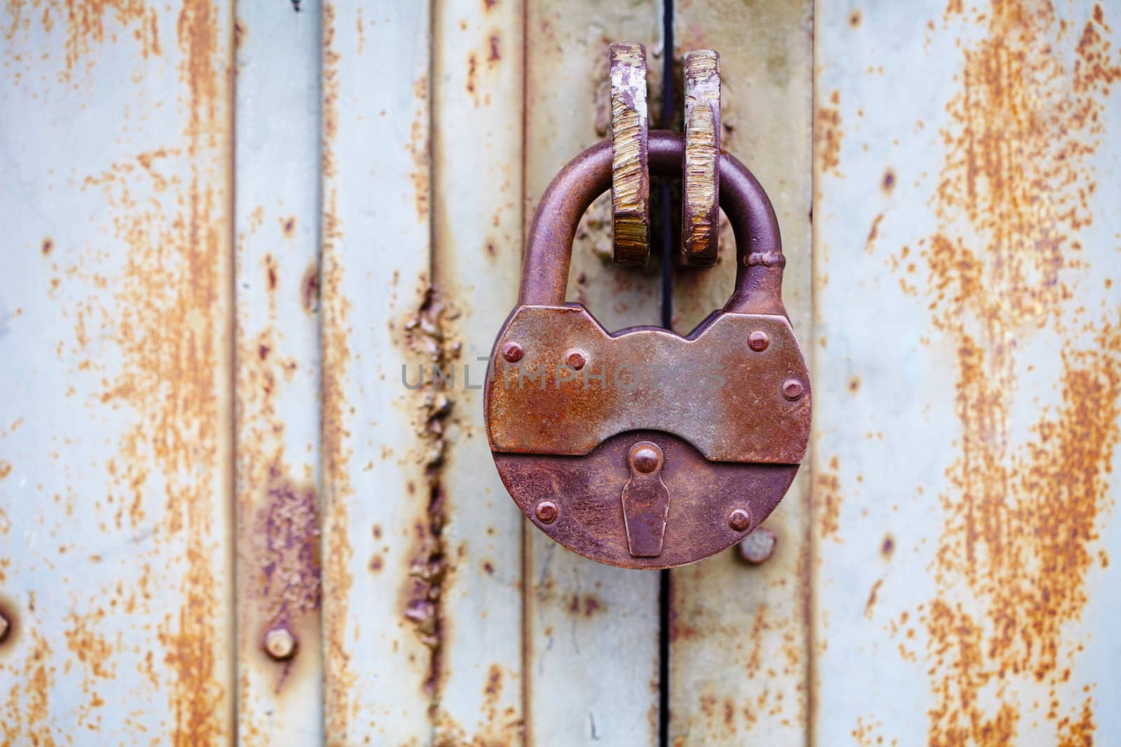 The big ancient padlock on a door