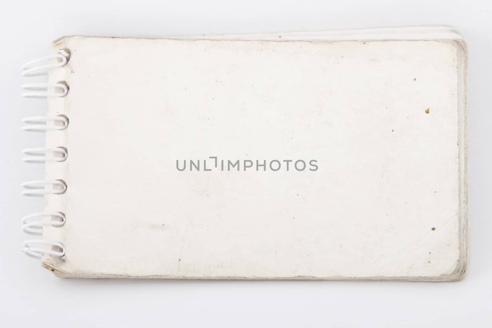 front view of old notebook on white background
