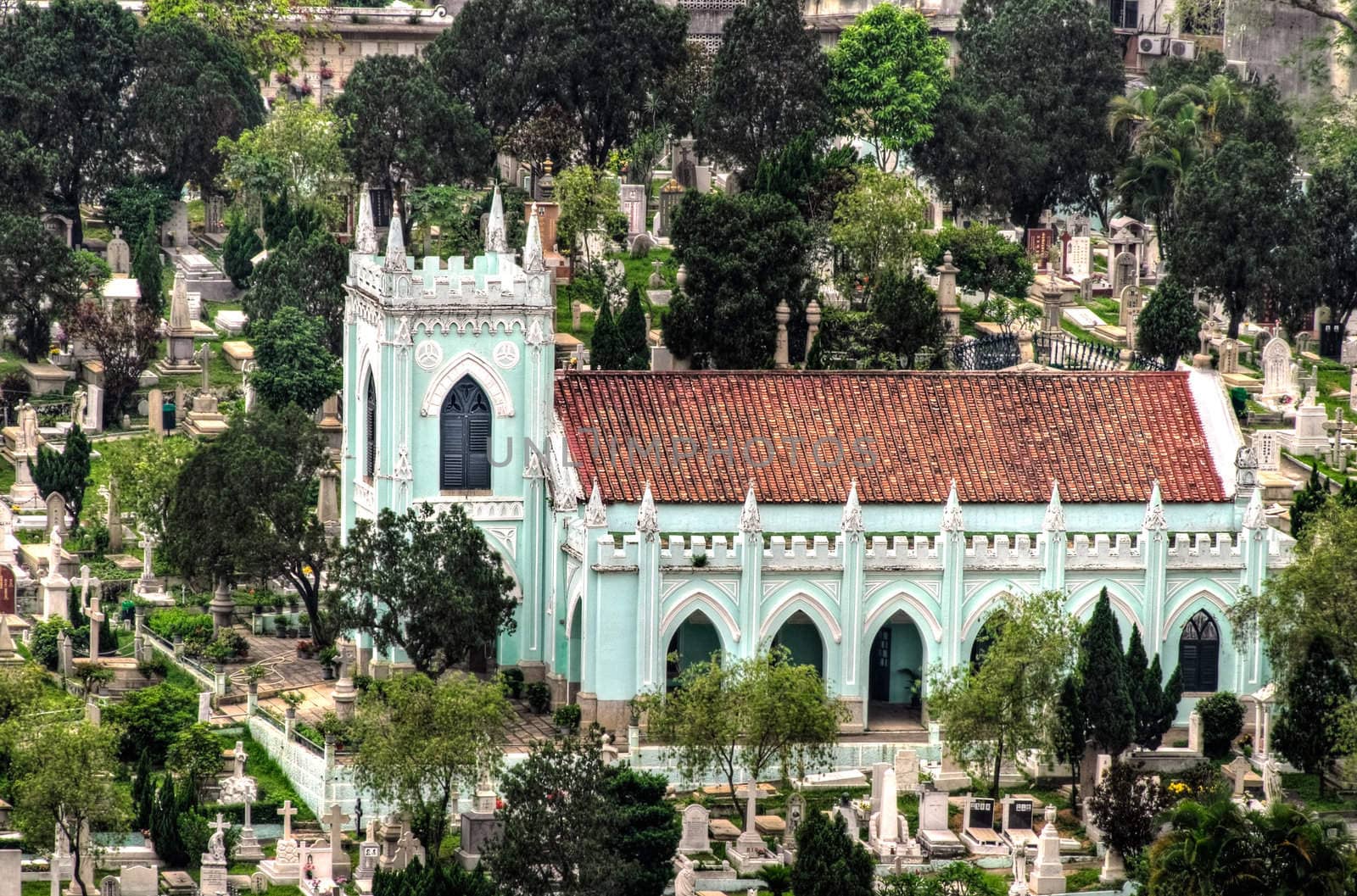Churchyard in Macao. Church with tombs and graves.