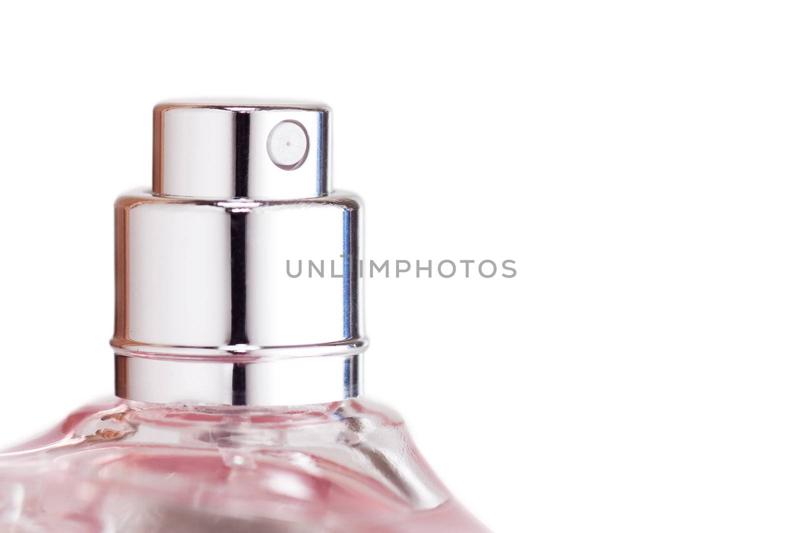 Sprayer of transparent perfume bottle isolated on while background. Macro view.