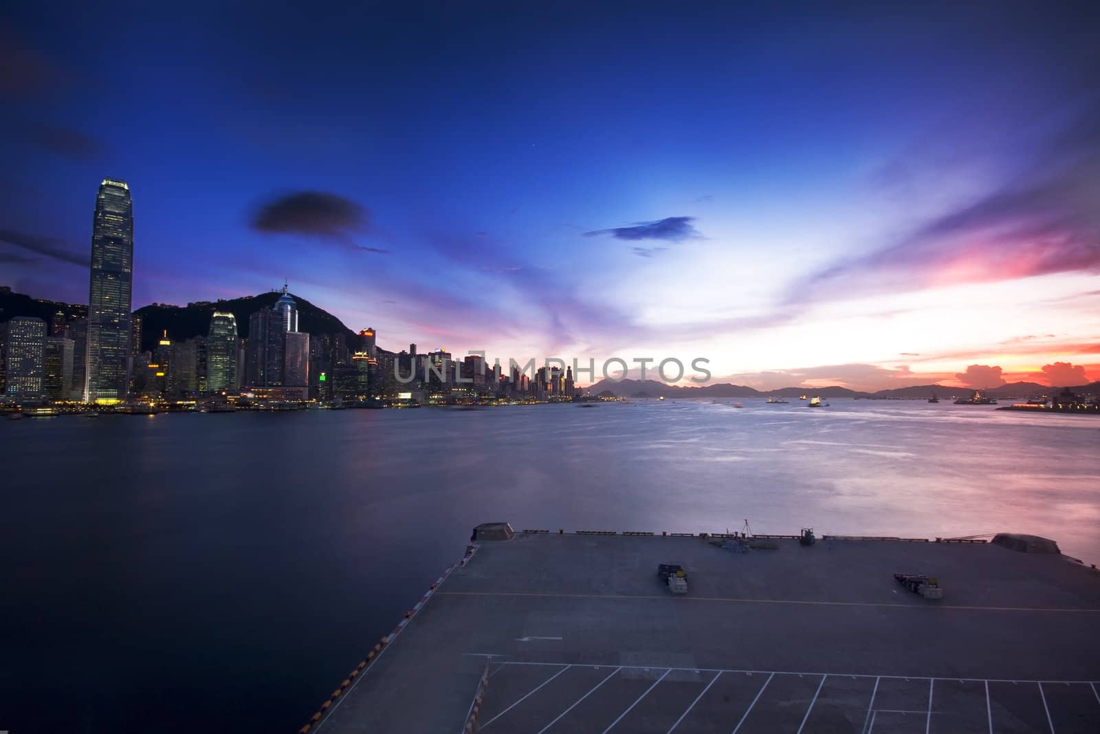 Hong Kong cityscape in sunset and dock