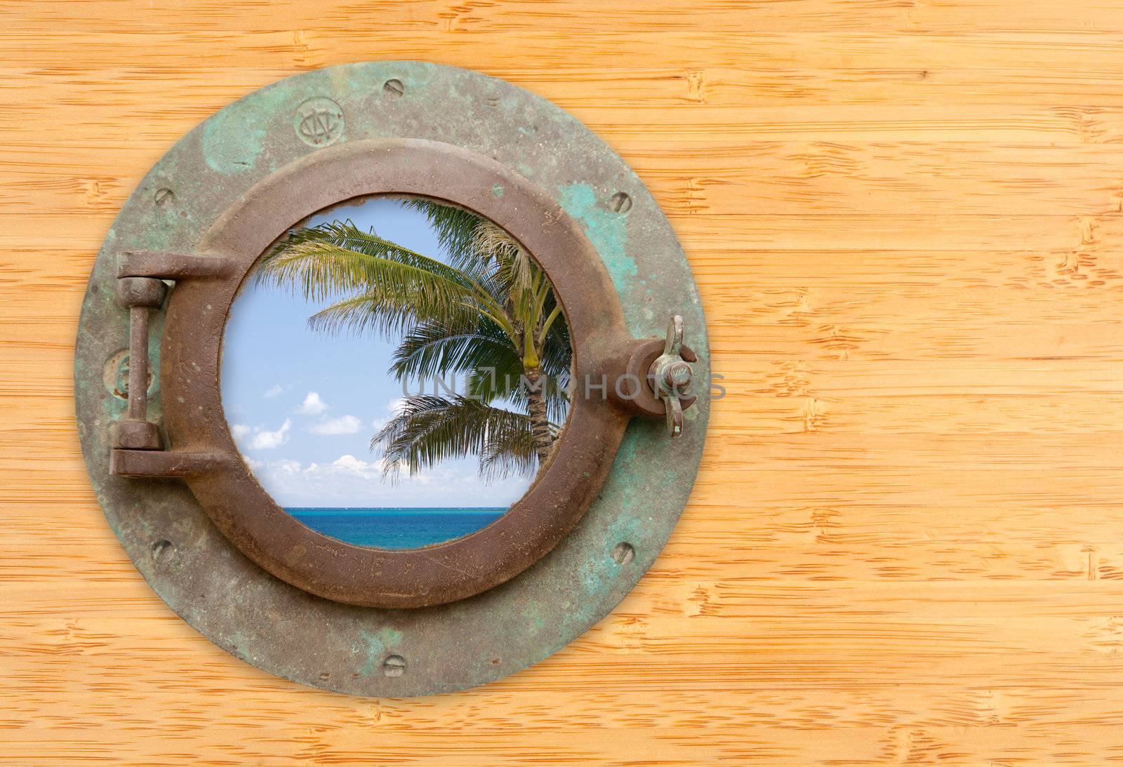 Antique Porthole with Tropical Beach View on a Bamboo Wall Background.